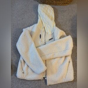 Joy, lab women’s cream/white fleece zip up jacket with waterproof hood.